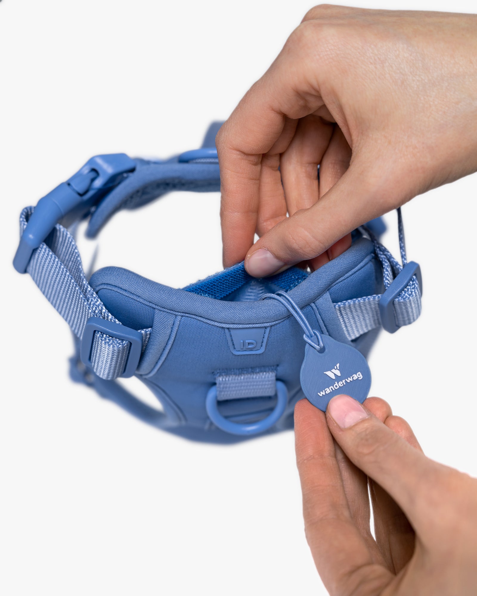 hands showcasing the ID tag pocket